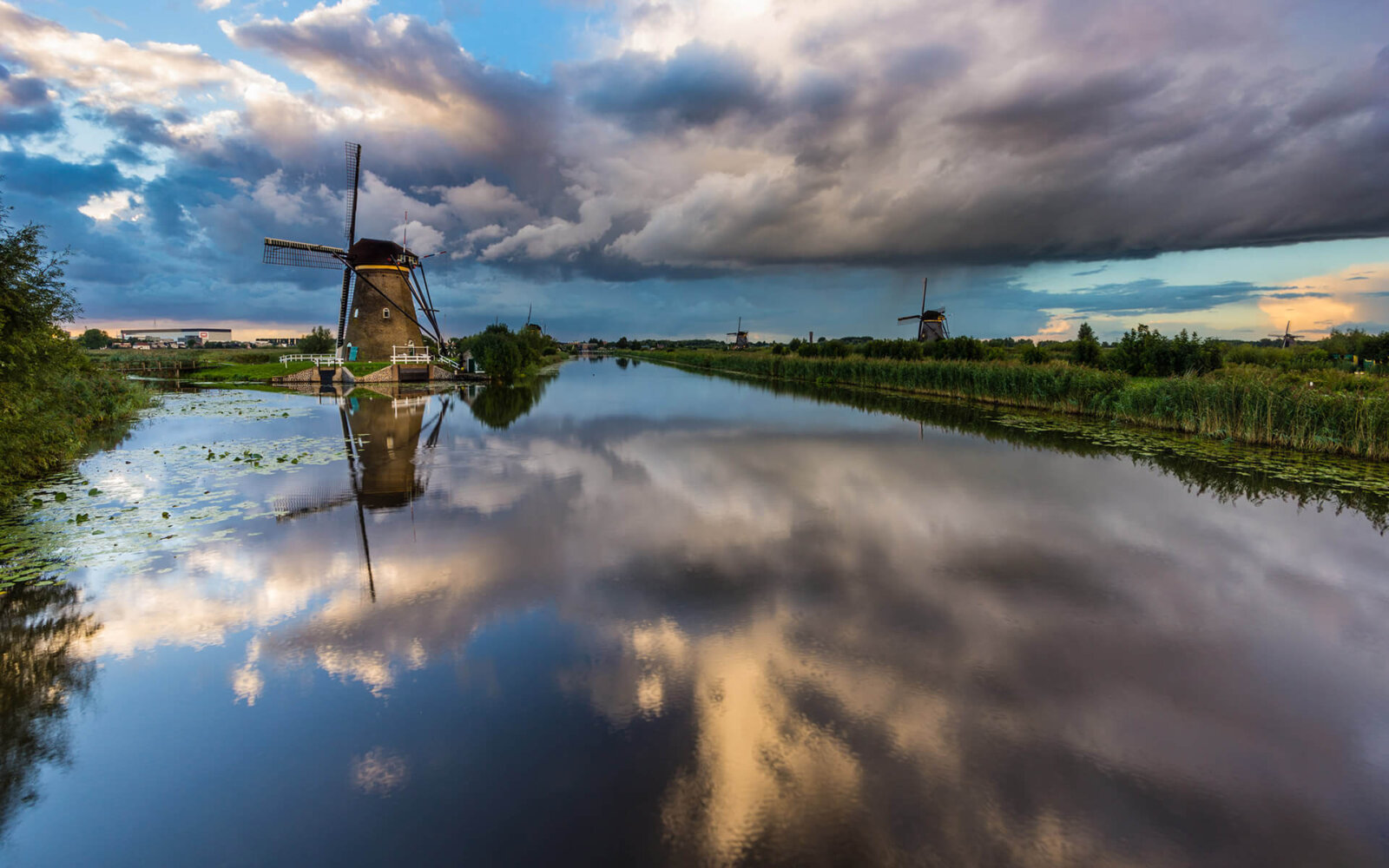 Kinderdijk Heavy rain clouds drift over the Kinderdijk windmills.