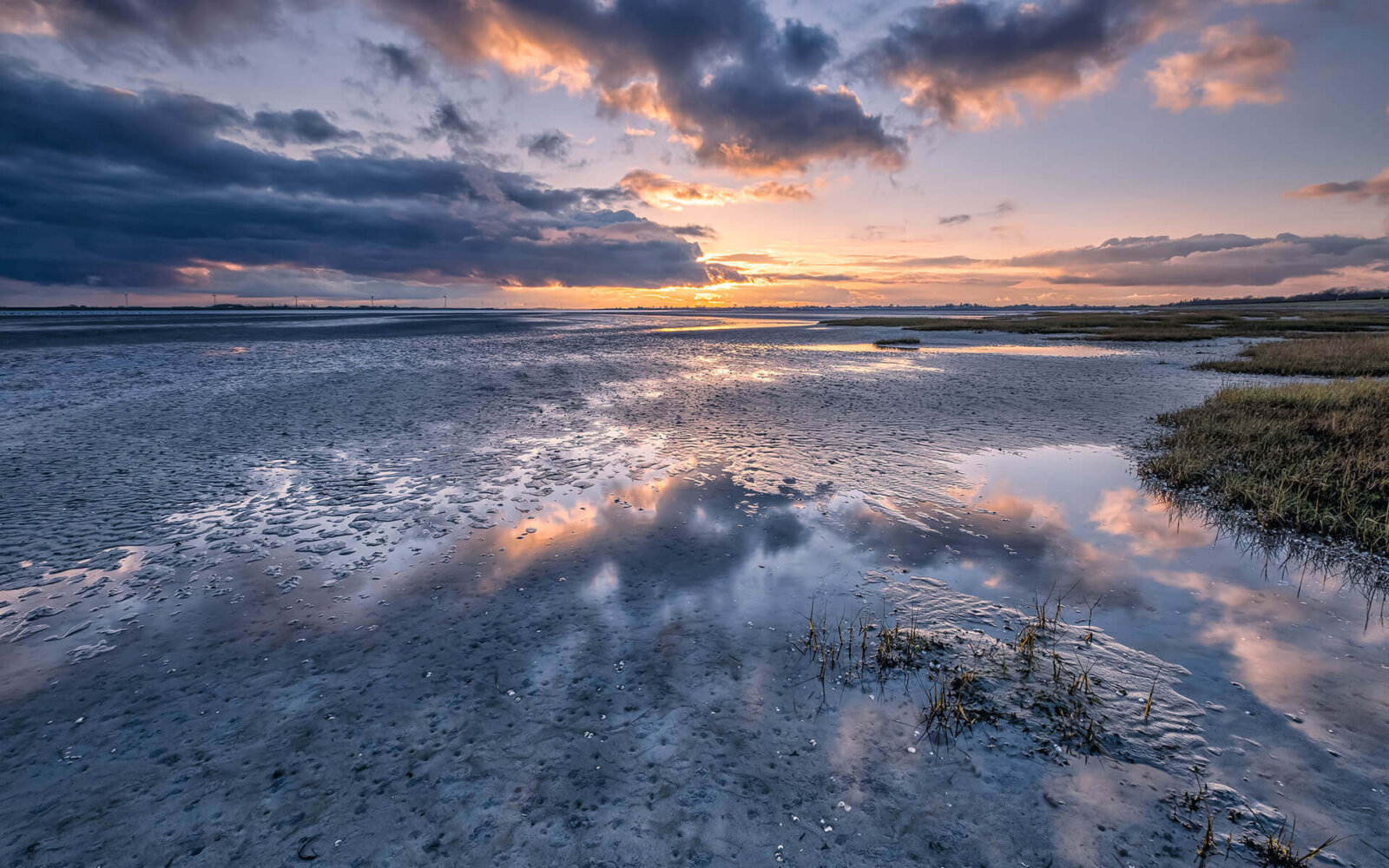 NP Oosterschelde Low tide, with dry land, of the Oosterschelde at Bruinisse at sunset.