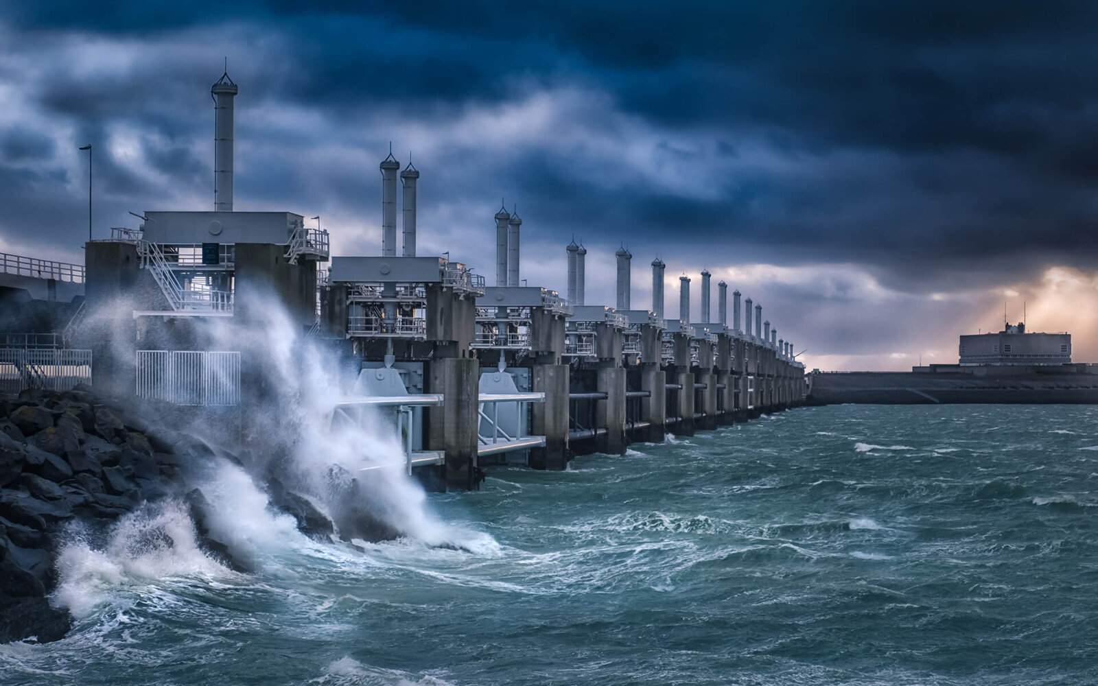 Neeltje Jans During a storm, the waves, with a threatening sky above them, break against the Delta Works of Neeltje Jans.