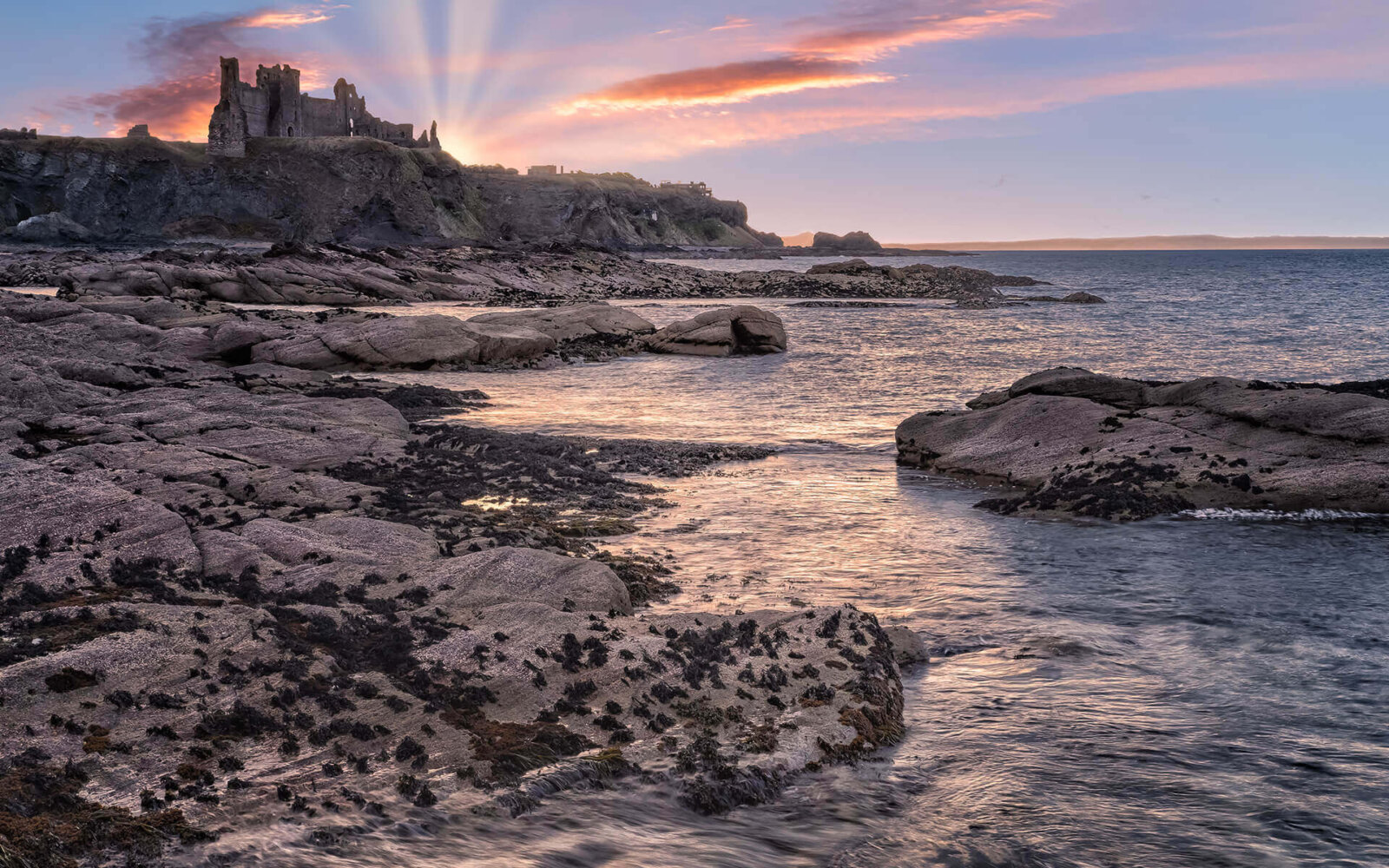Tantallon Castle On the rocky shores of the Scottish Borders, at sunset, lies Tantallon Castle.