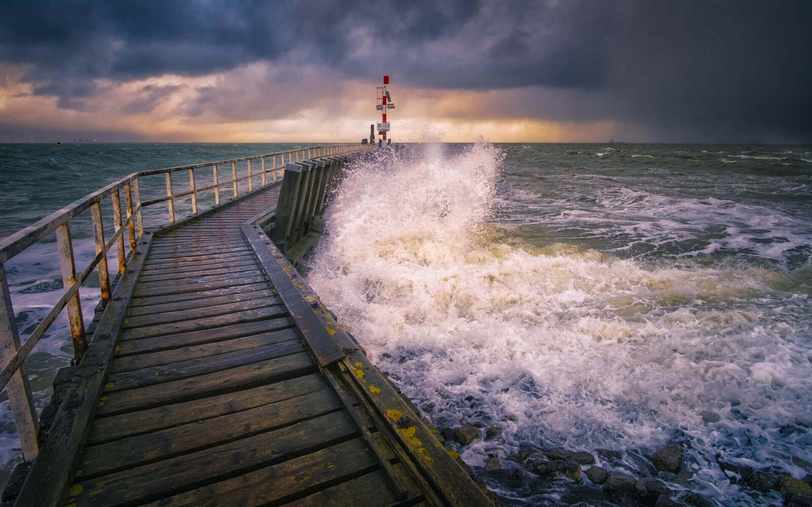 Breaking wave on a jetty, during a storm near Vlissingen.