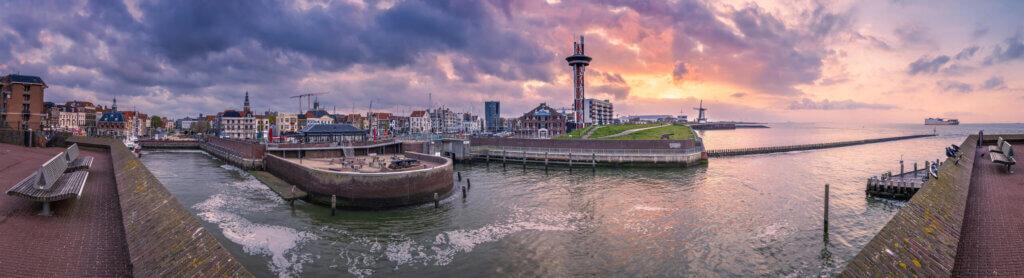 A beautiful panoramic sunrise at Vlissingen with the center and harbor in view.