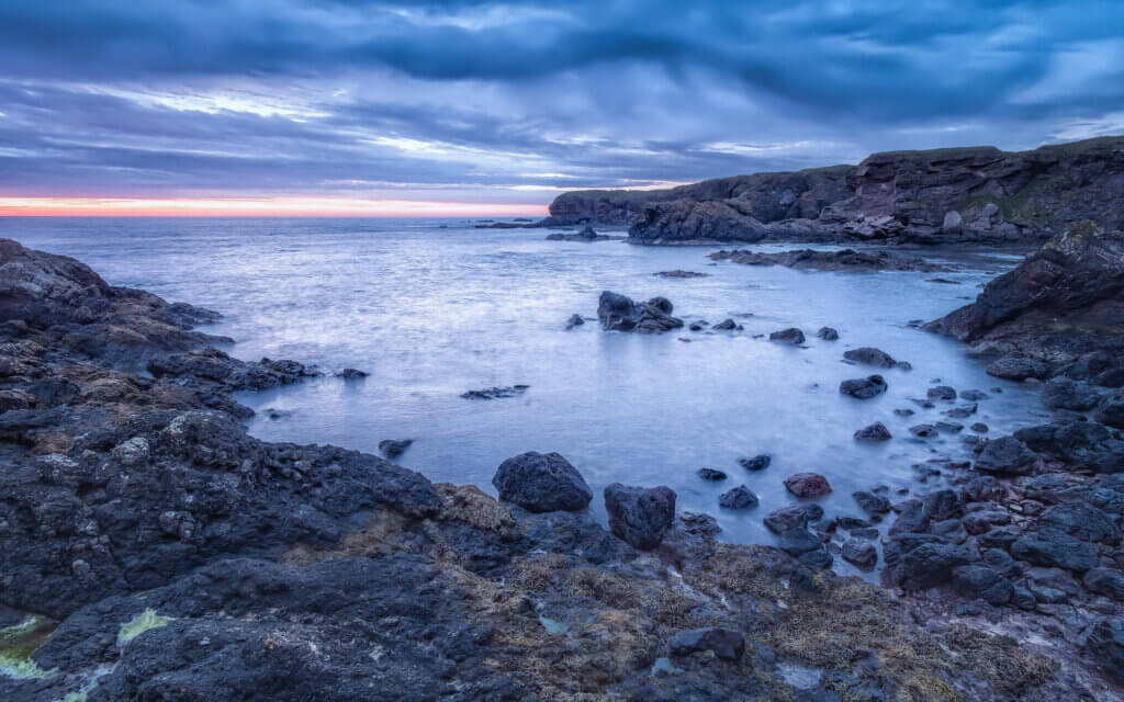 Before sunrise, on the rugged coast of Eyemouth in the Scottish Borders.
