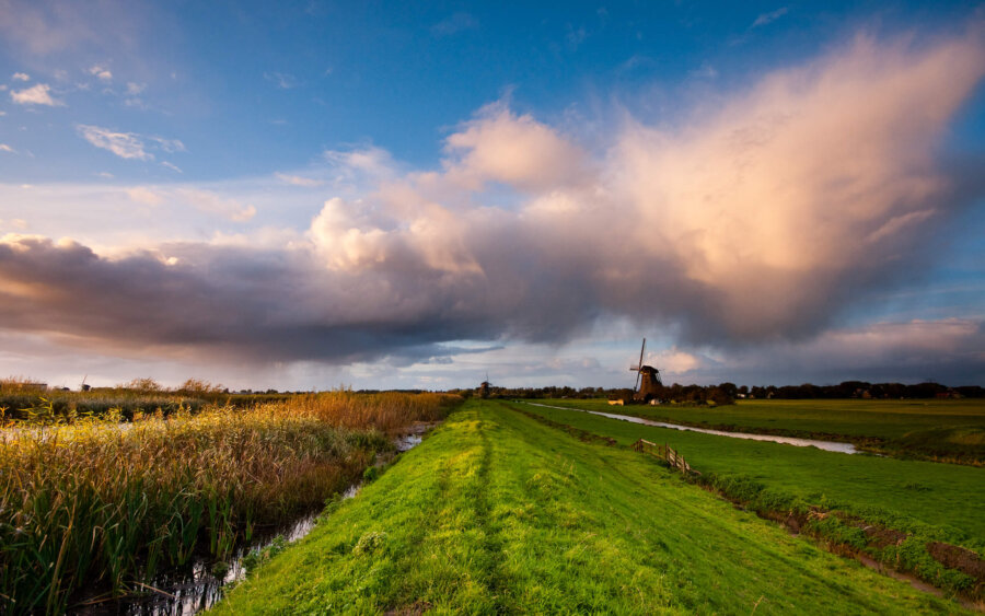 Typical Dutch sky over Kinderdijk and a mill.