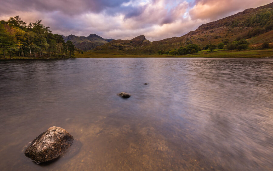 The beautiful little lake Blea Tarn lies between the hills of the Lake District.