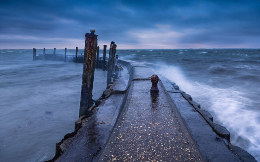 Kerkwerve On a stormy day at the harbor entrance of Flaauwers harbor, near Kerkwerve.