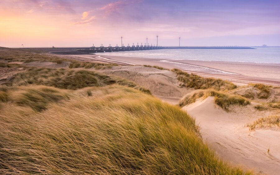From the dunes at Westenschouwen, view of the Delta Works of Neeltje Jans, with the first morning light.