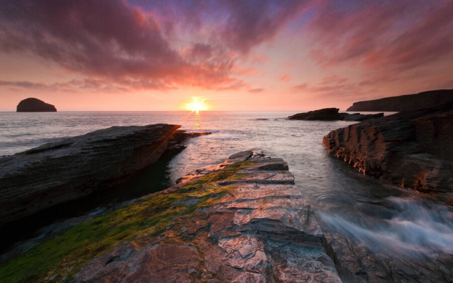 A beautiful sunset at the rugged coastline of Trebarwith Beach, near Tintagel in Cornwall.
