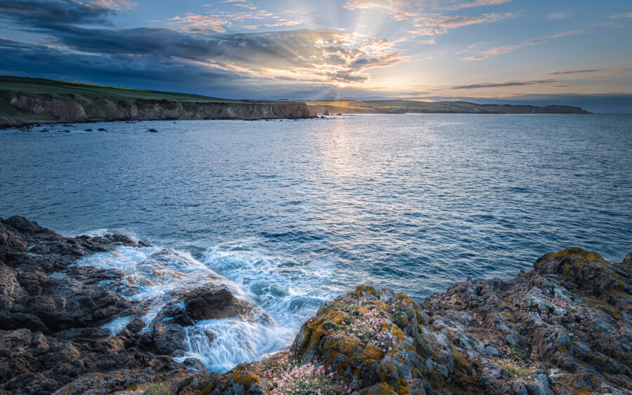 After the rain, the sky clears and you feel the warmth of the light again over the Scottish coast.