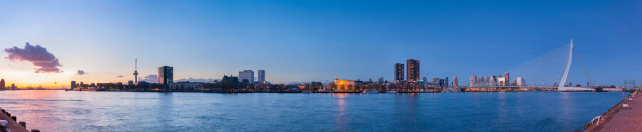 Rotterdam in evening light, a panorama with an almost entirely blue sky.