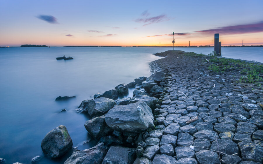 On a quiet evening by a breakwater on the Hollands Diep near Moerdijk.