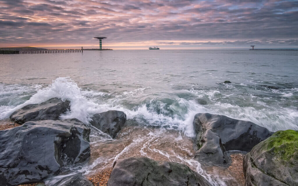 A ship leaves the safe harbor of the Maasvlakte, near Rotterdam, out into the North Sea.