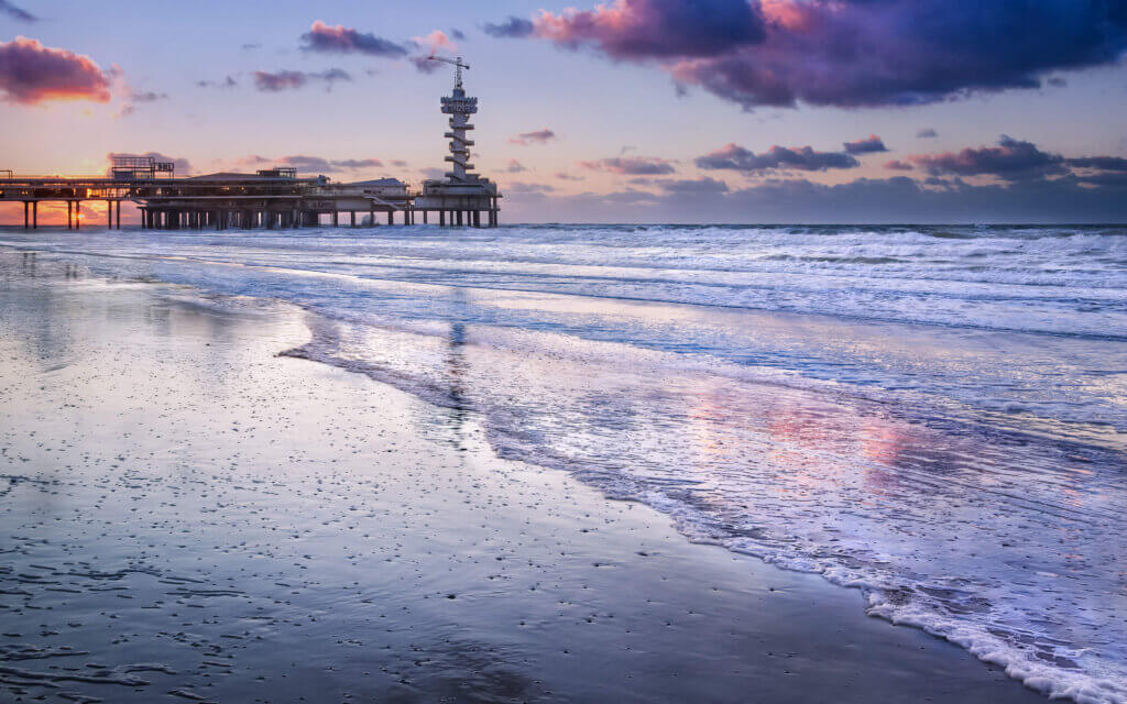 On a beautiful evening on the coast of Scheveningen with a view of the pier.
